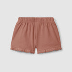 Short ajusté terracotta à volants