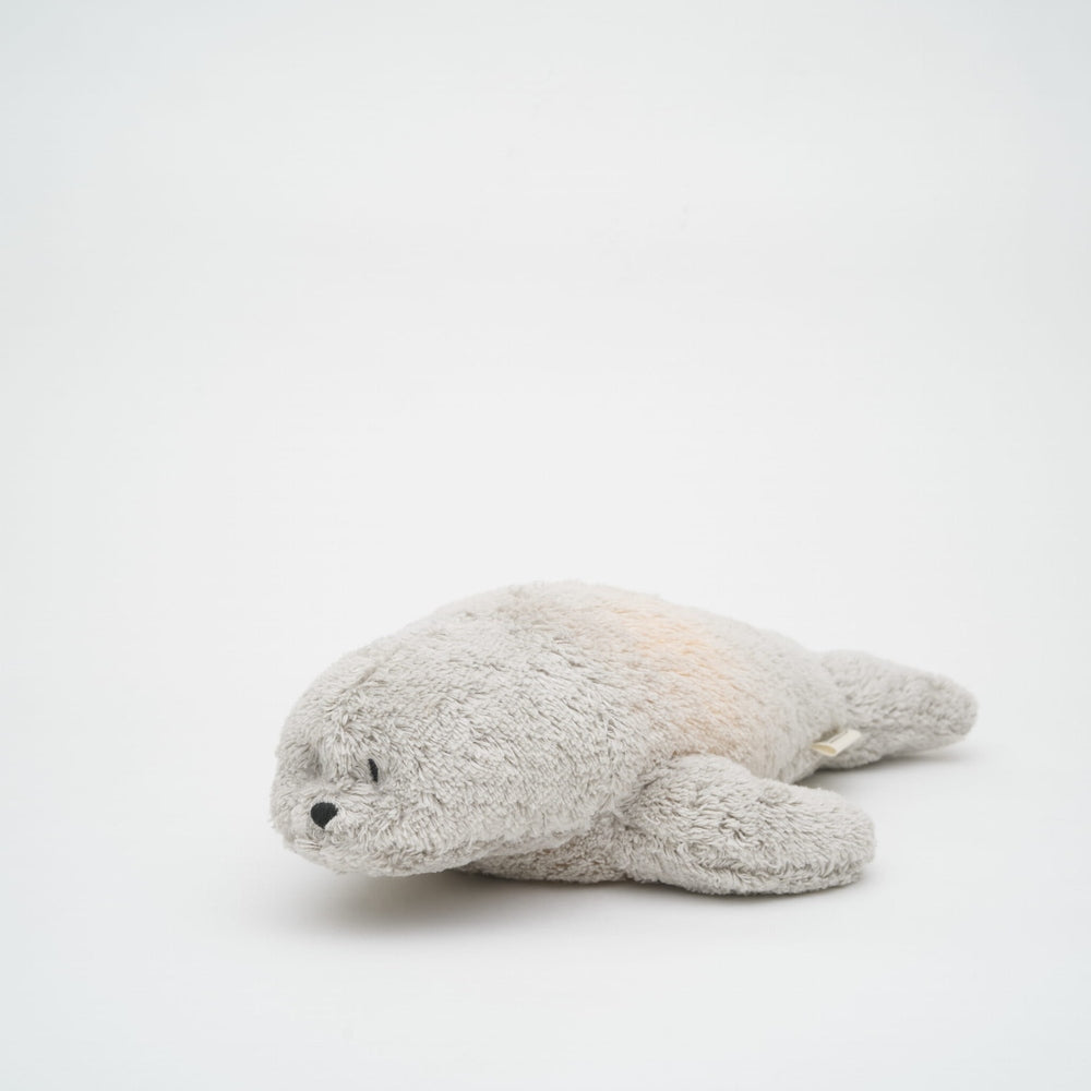 Peluche Moonie - The Humming Seal Organic 2.0 - Gris naturel | Phoque à bruit blanc avec veilleuse